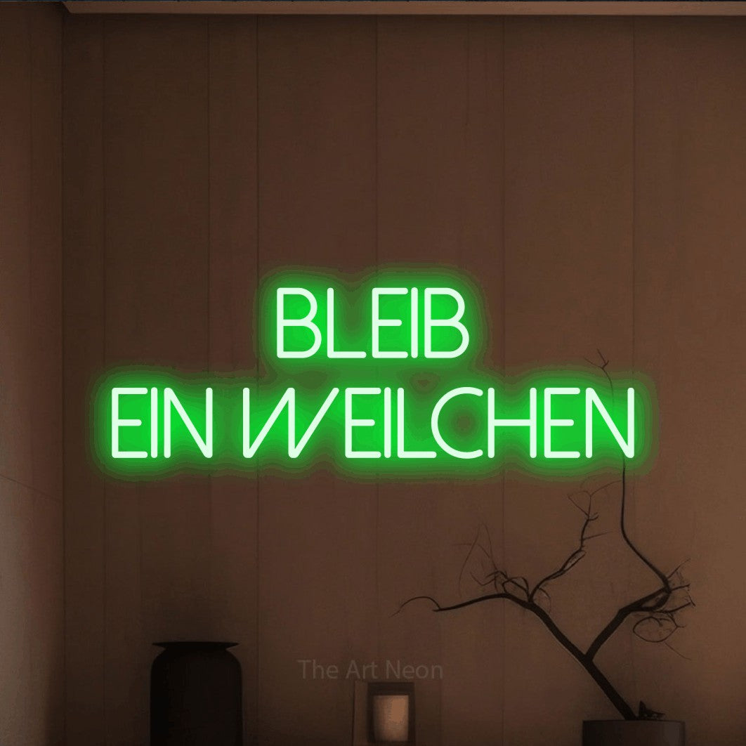 LED neon sign reading “BLEIB EIN WEILCHEN”, arranged in 2 lines.