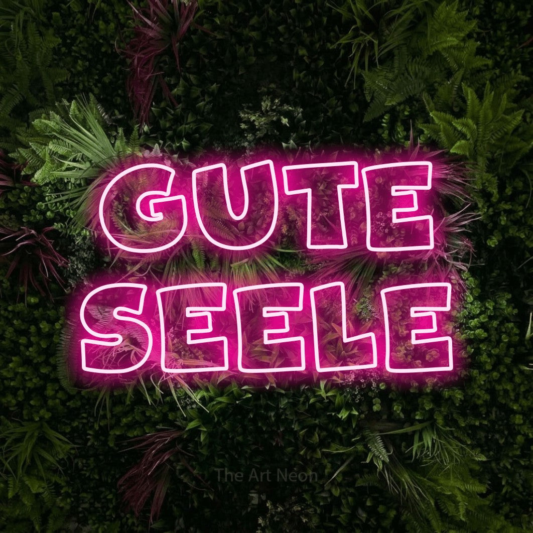 LED neon sign reading “gute seele”, arranged in 2 lines.