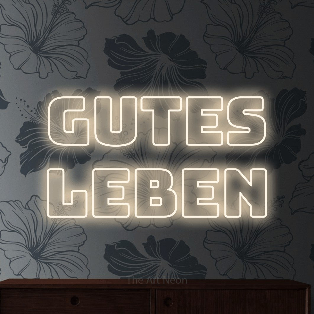 LED neon sign reading “Gutes Leben”, arranged in 2 lines.