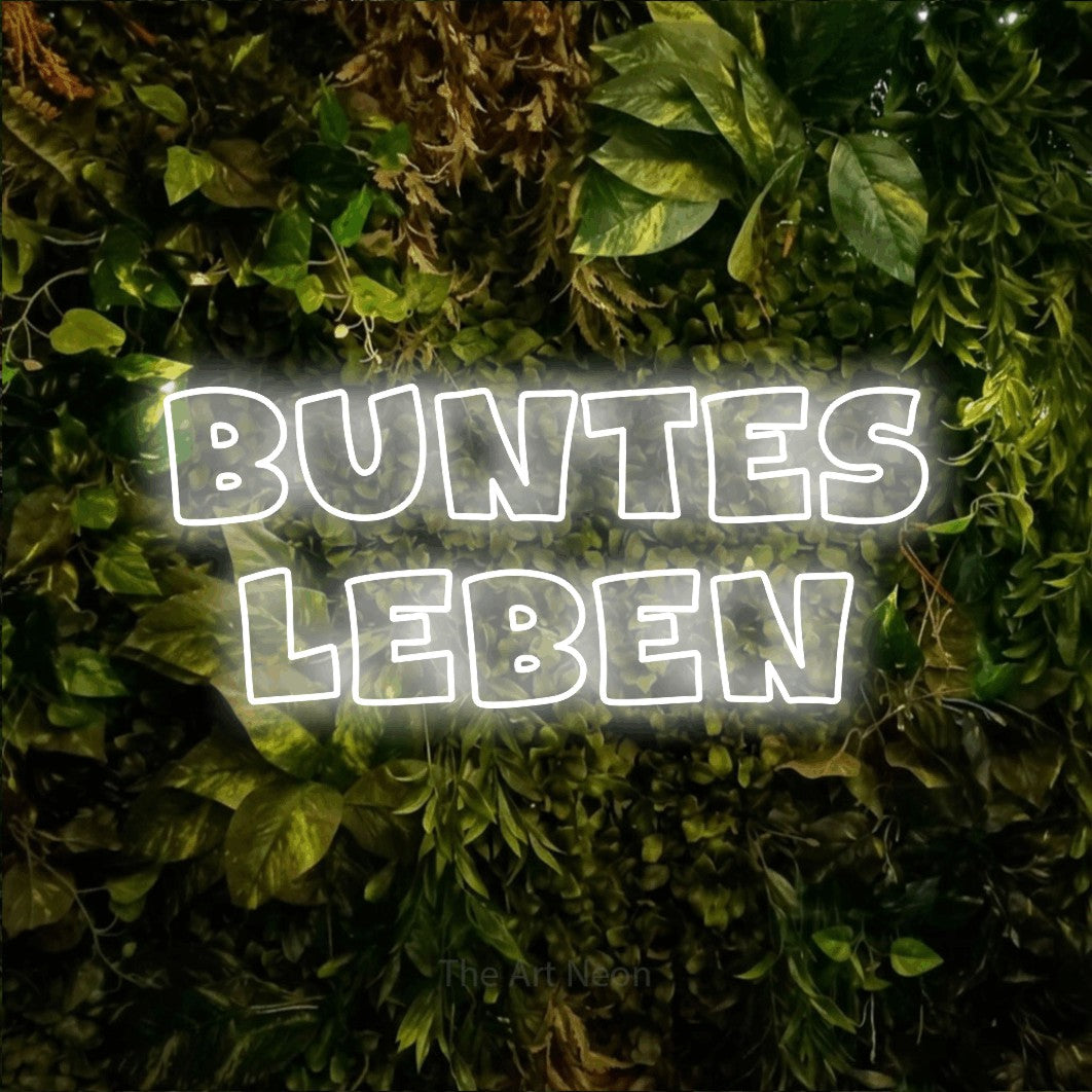 LED neon sign reading “buntes leben”, arranged in 2 lines.