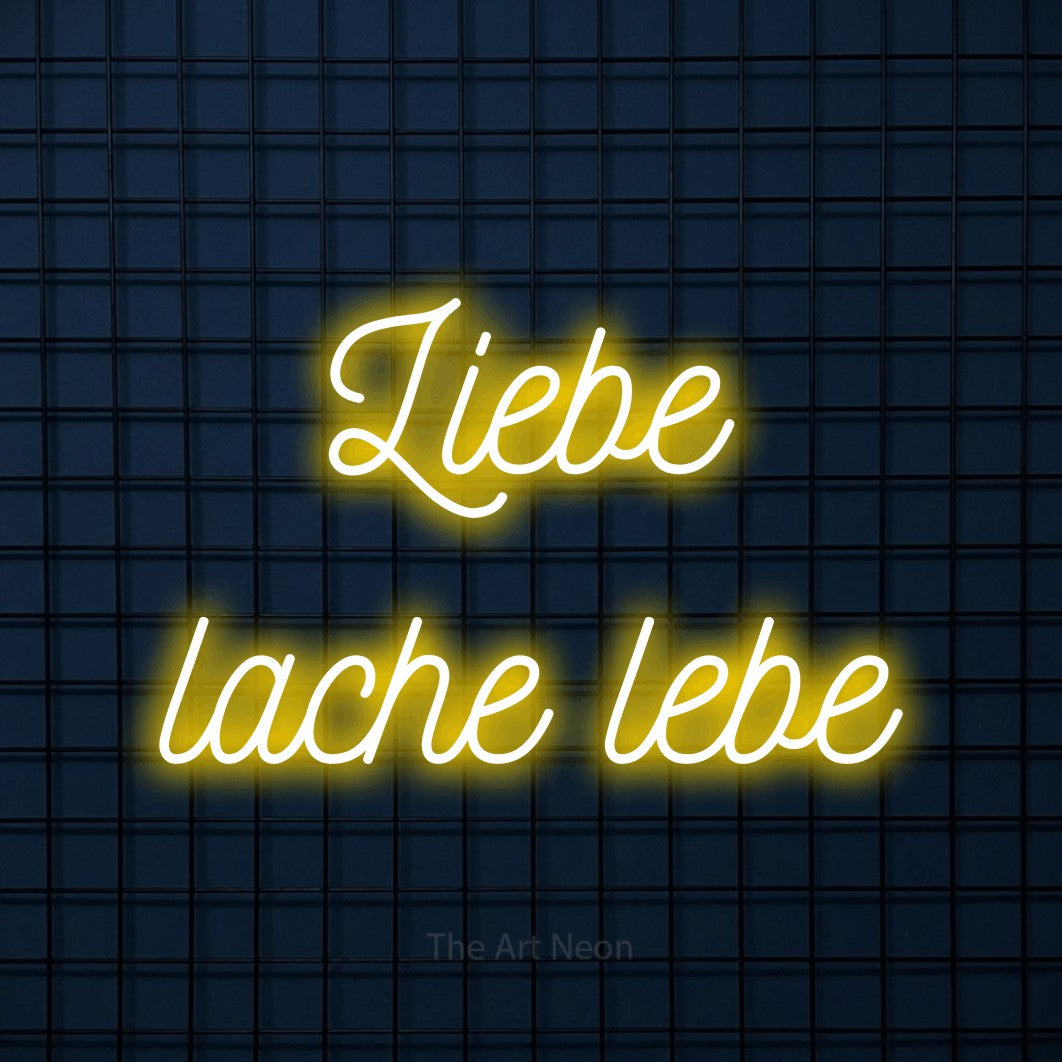 LED neon sign reading “Liebe lache lebe”, arranged in 2 lines.