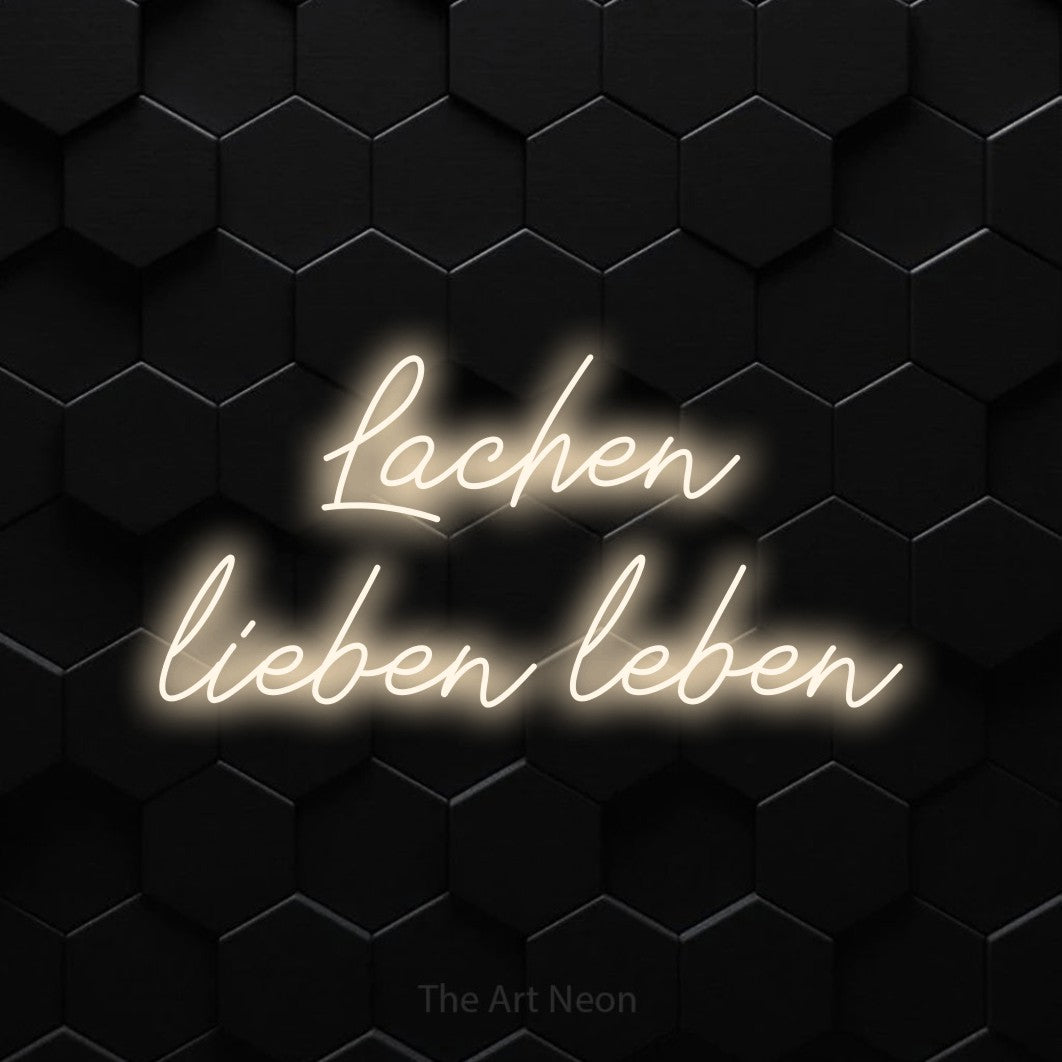 LED neon sign reading “Lachen lieben leben”, arranged in 2 lines.