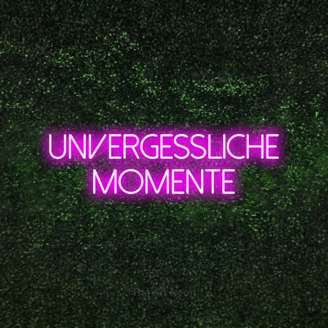 LED neon sign reading “unvergessliche momente”, arranged in 2 lines.