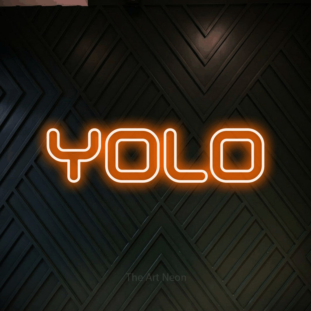 LED neon sign reading “YOLO”, arranged in a single line.