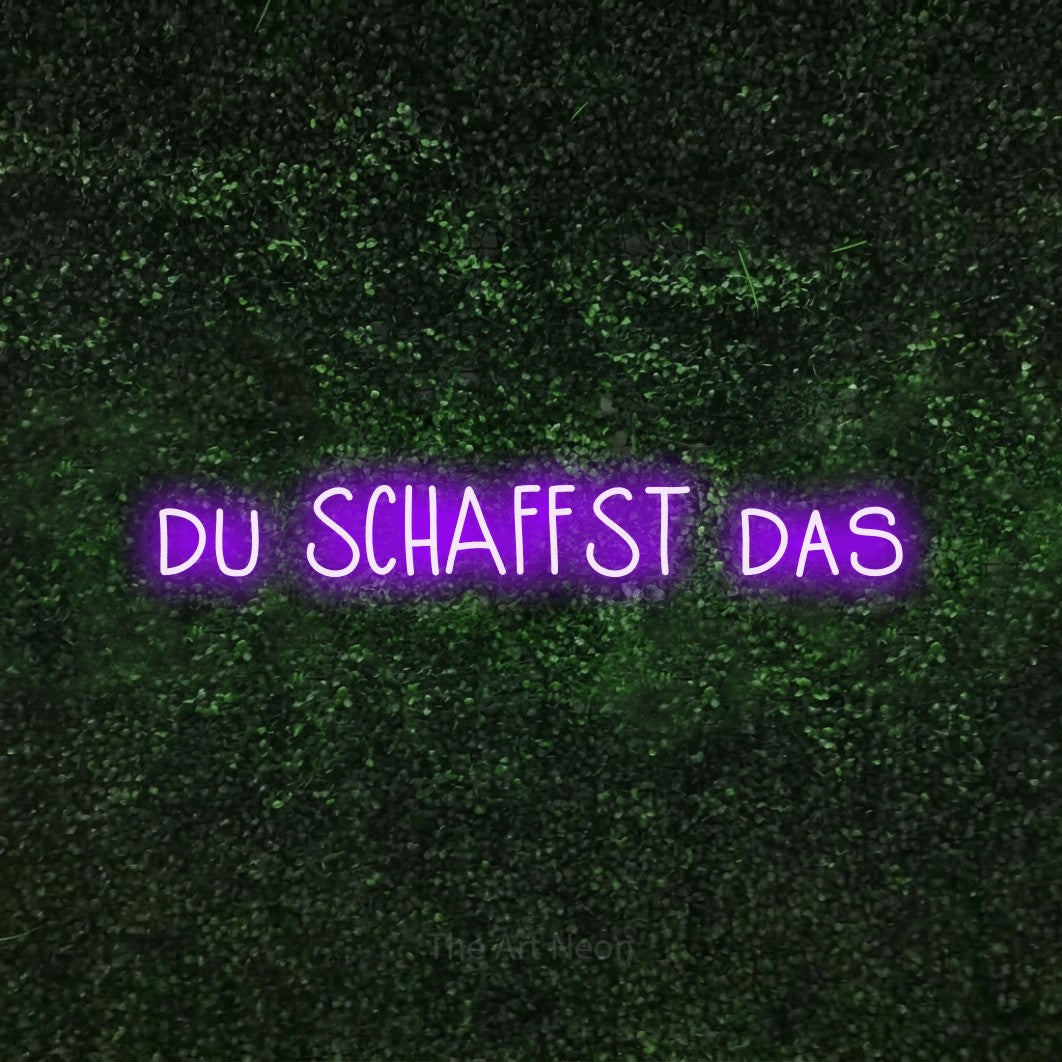 LED neon sign reading “du SCHAFFST das”, arranged in a single line.