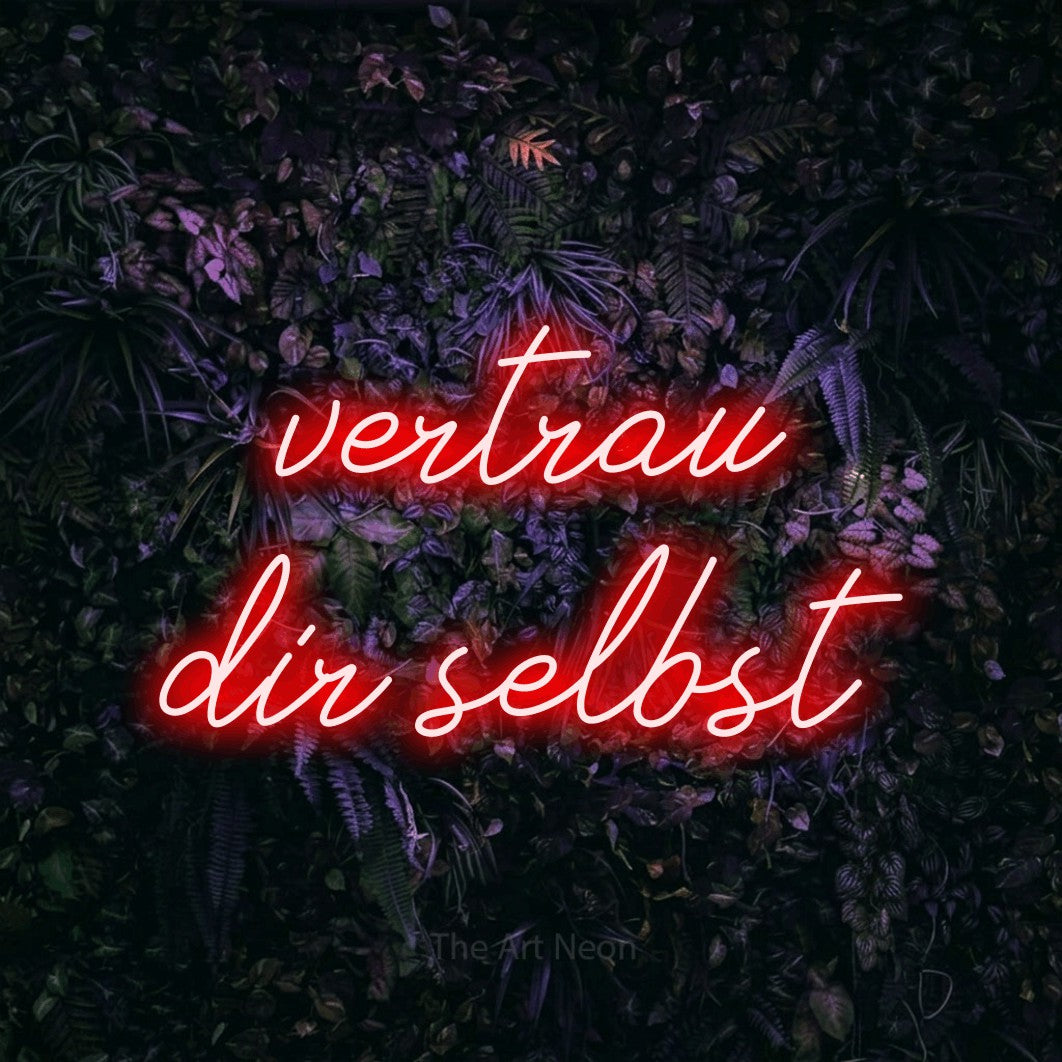LED neon sign reading “vertrau dir selbst”, arranged in 2 lines.