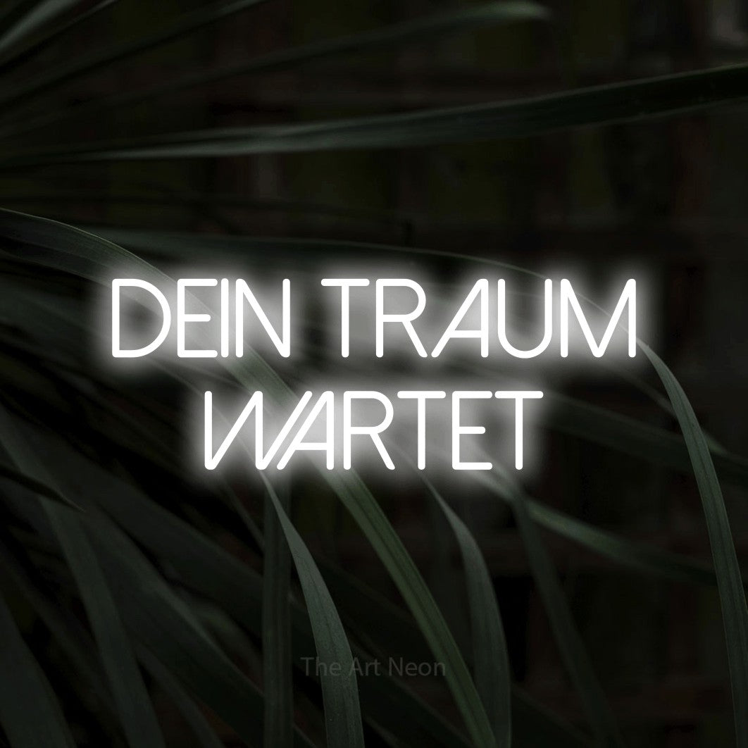 LED neon sign reading “Dein Traum wartet”, arranged in 2 lines.