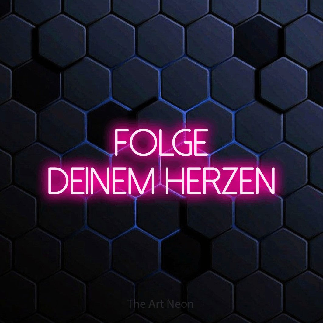 LED neon sign reading “folge deinem herzen”, arranged in 2 lines.