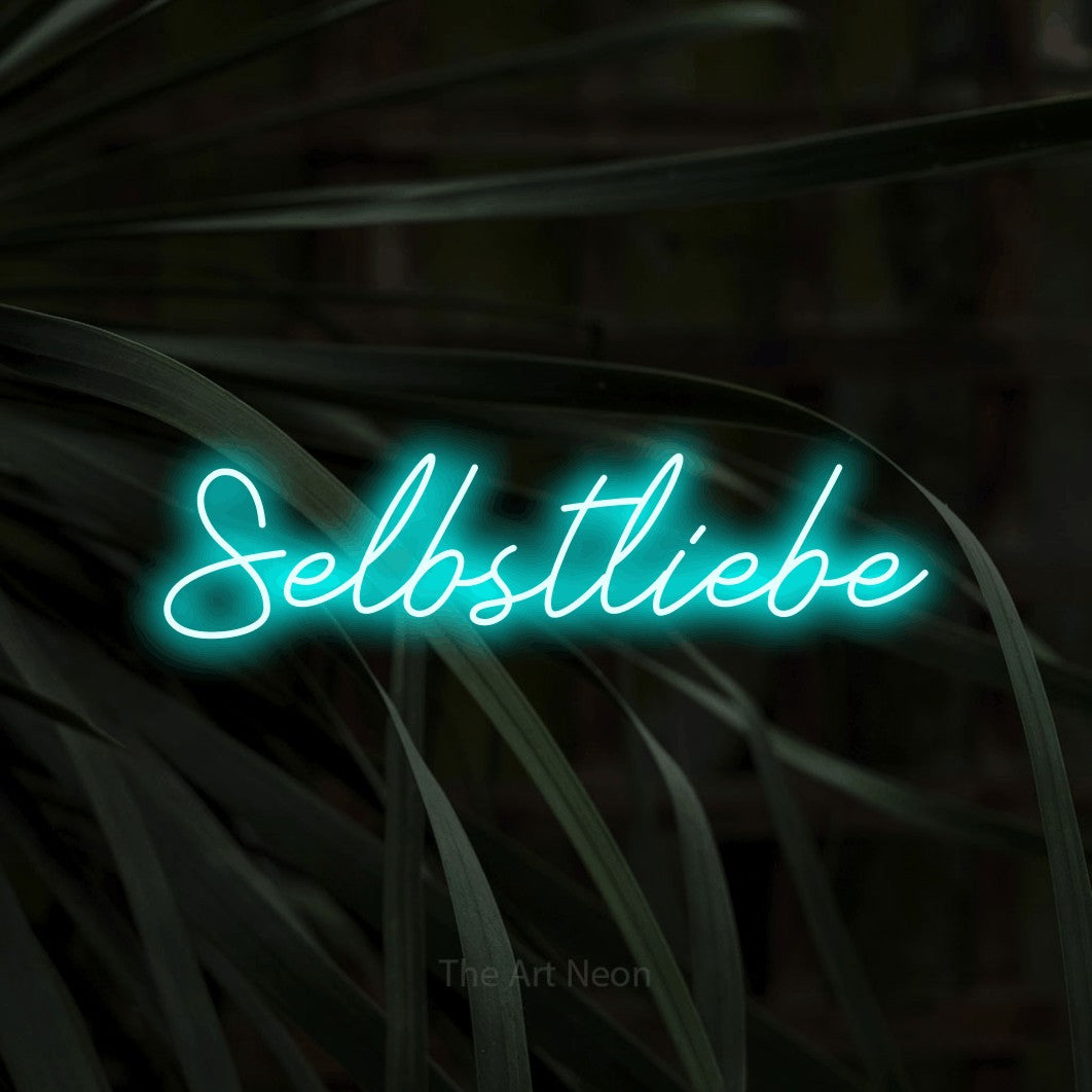 LED neon sign reading “Selbstliebe”, arranged in a single line.