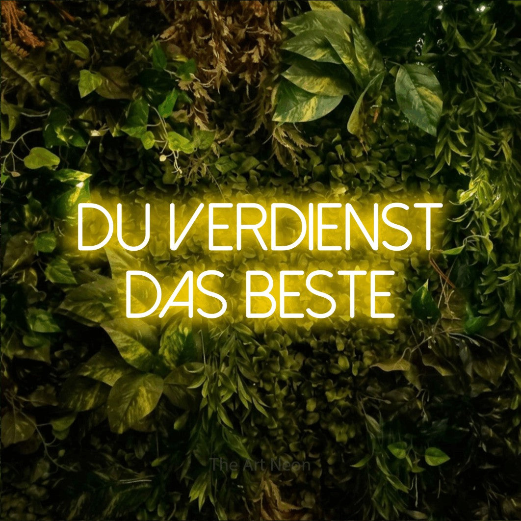 LED neon sign reading “du verdienst das beste”, arranged in 2 lines.