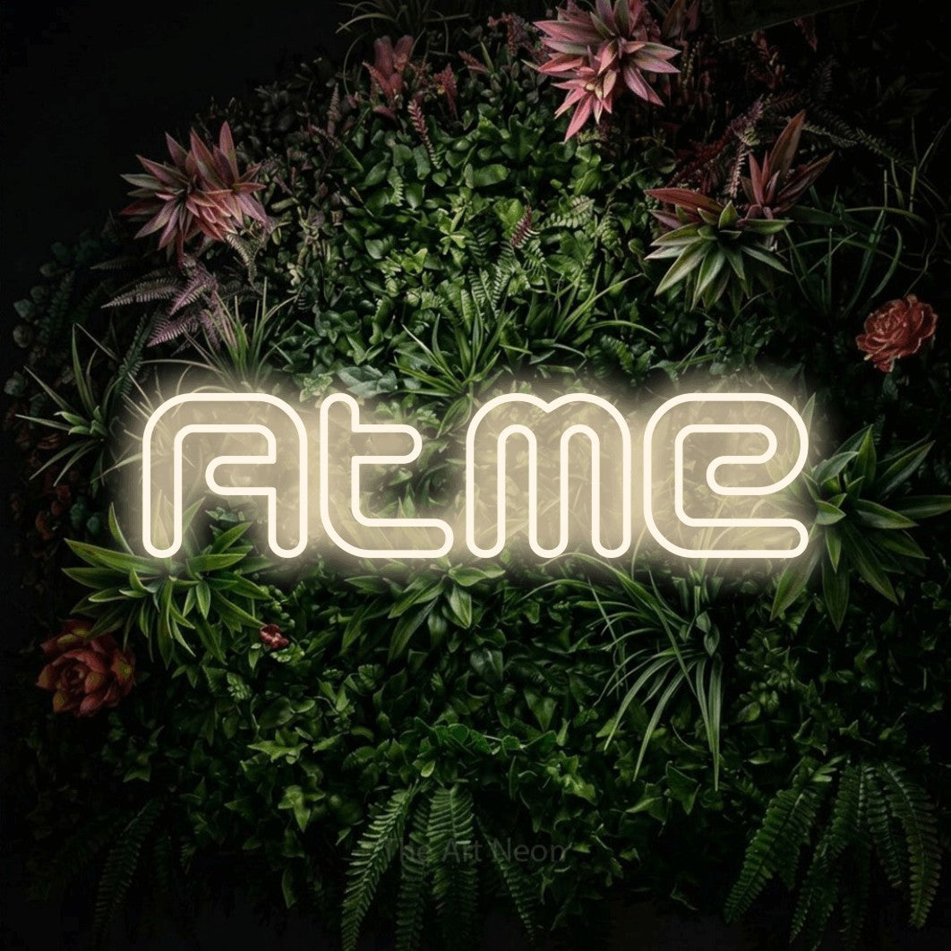 LED neon sign reading “Atme”, arranged in a single line.