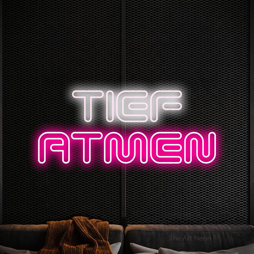LED neon sign reading “TIEF ATMEN”, arranged in 2 lines.