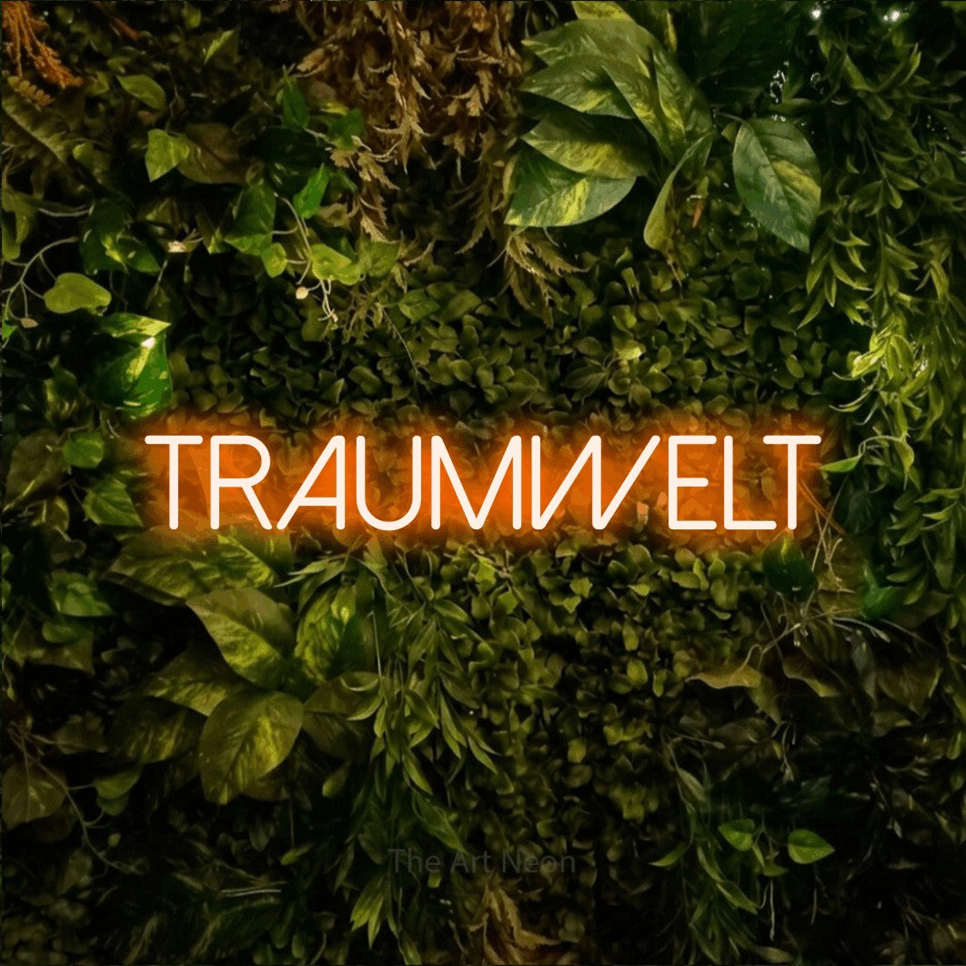 LED neon sign reading “Traumwelt”, arranged in a single line.