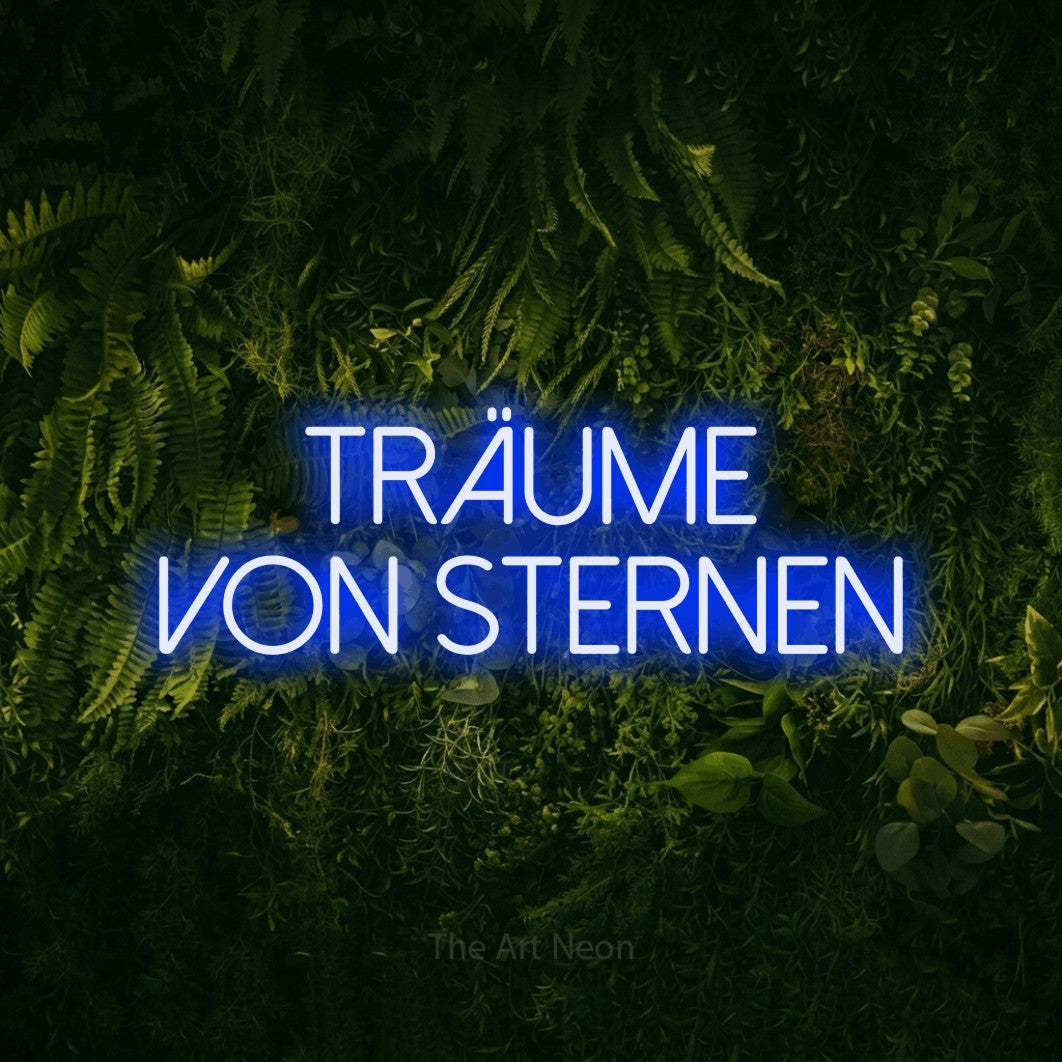LED neon sign reading “TRÄUME VON STERNEN”, arranged in 2 lines.