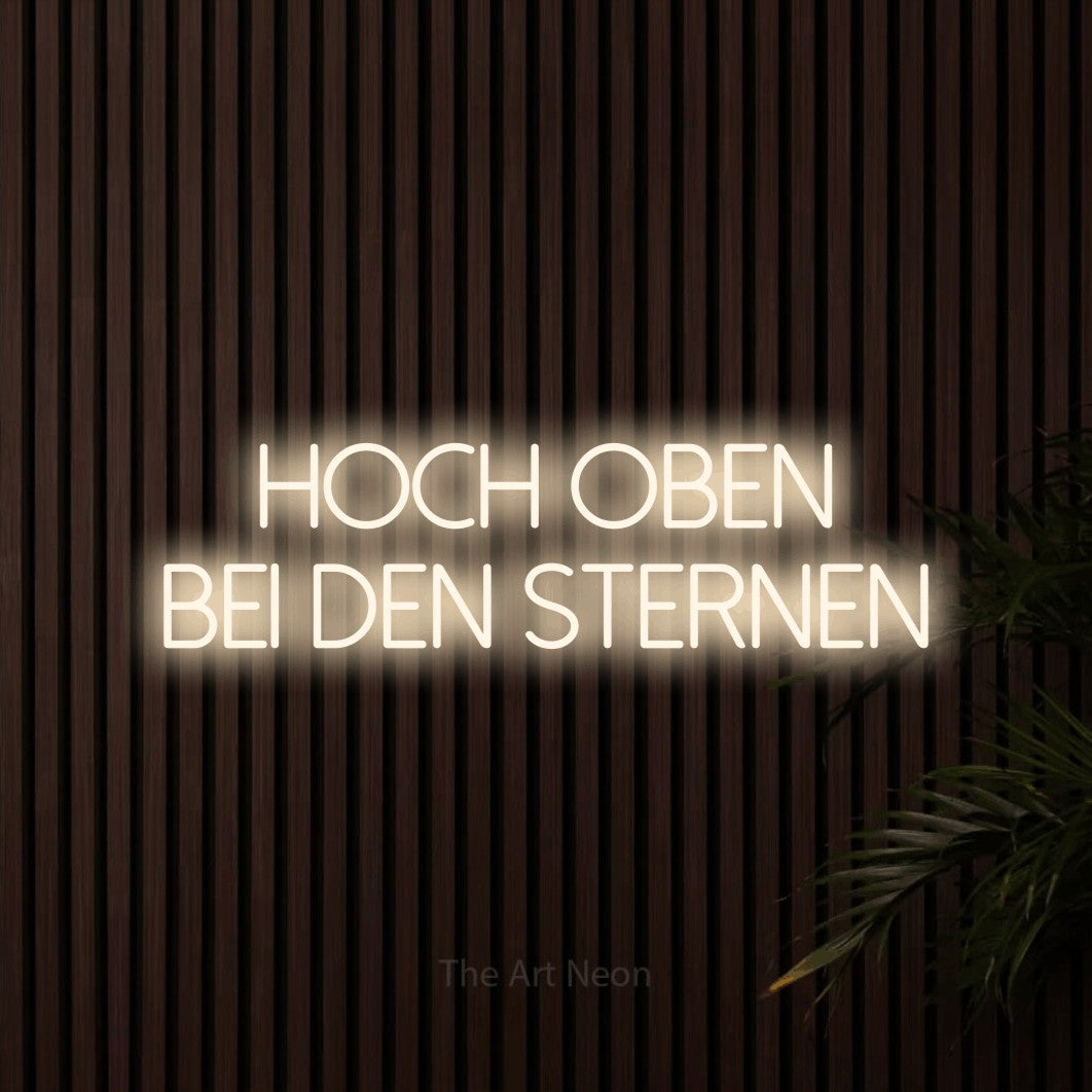 LED neon sign reading “hoch oben bei den sternen”, arranged in 2 lines.