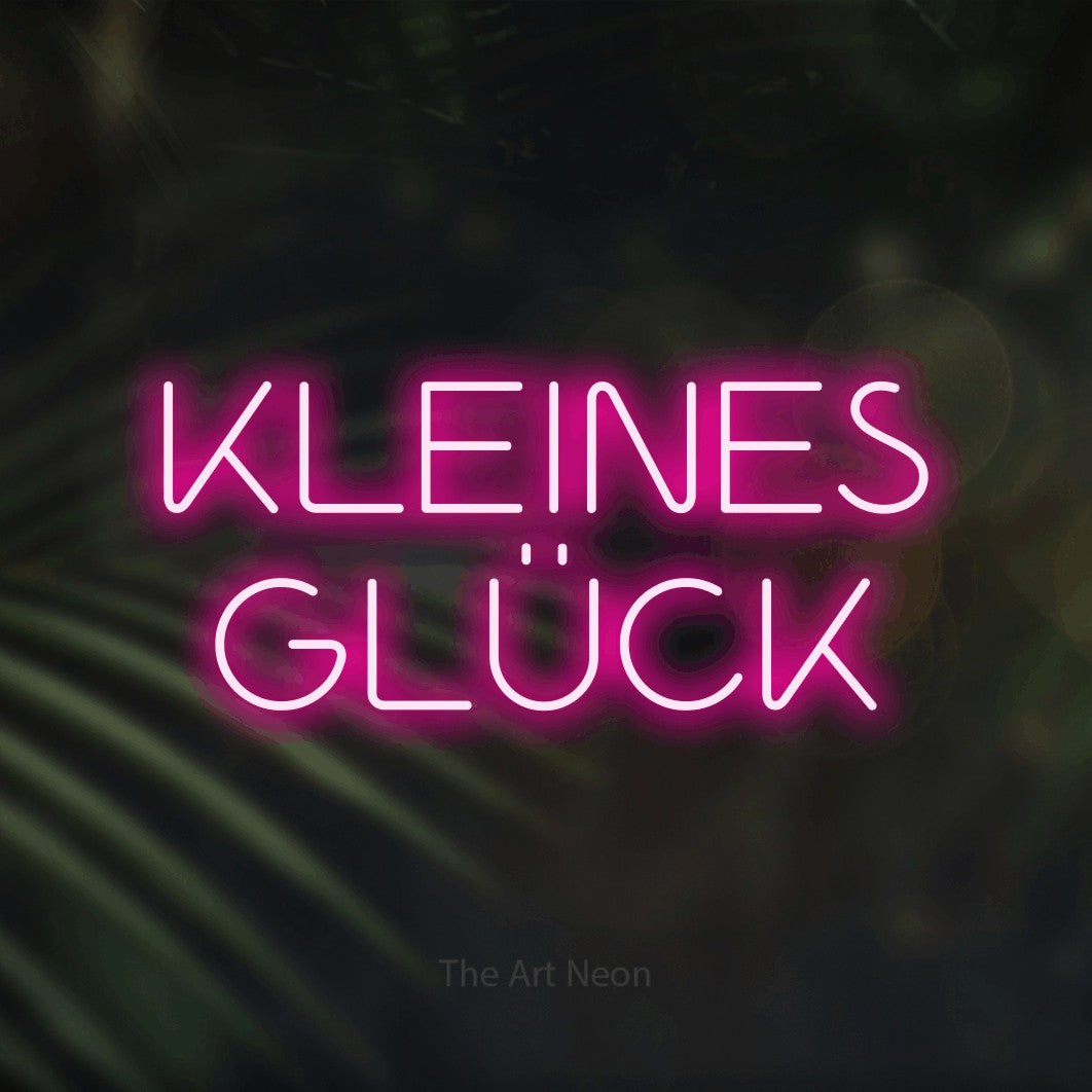 LED neon sign reading “KLEINES GLÜCK”, arranged in 2 lines.