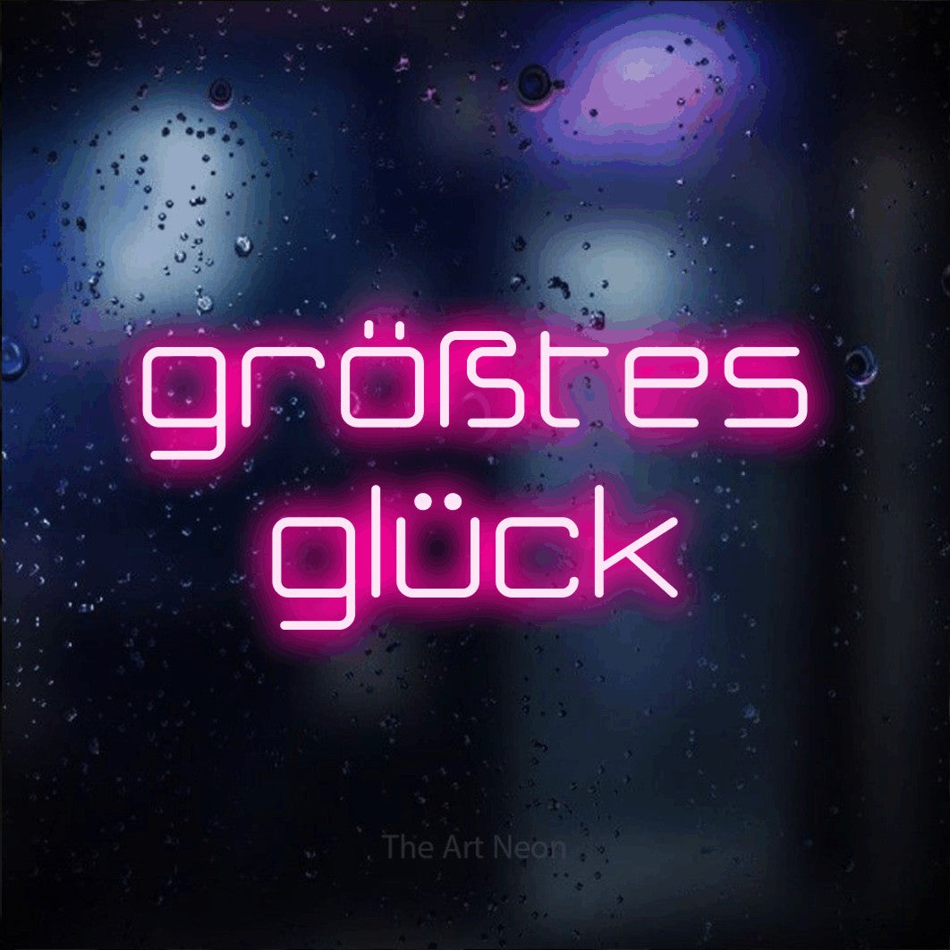 LED neon sign reading “größtes glück”, arranged in 2 lines.
