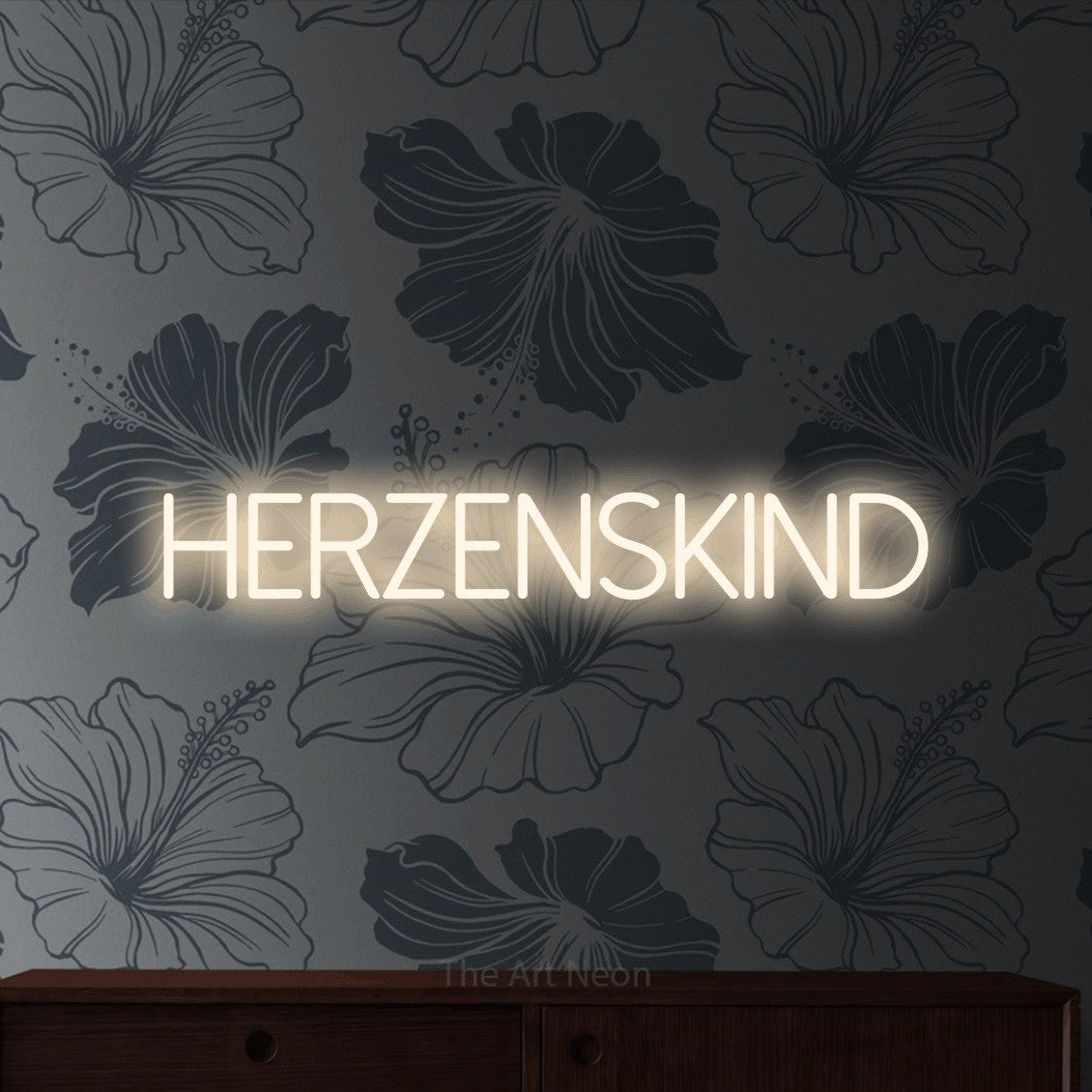 LED neon sign reading “Herzenskind”, arranged in a single line.