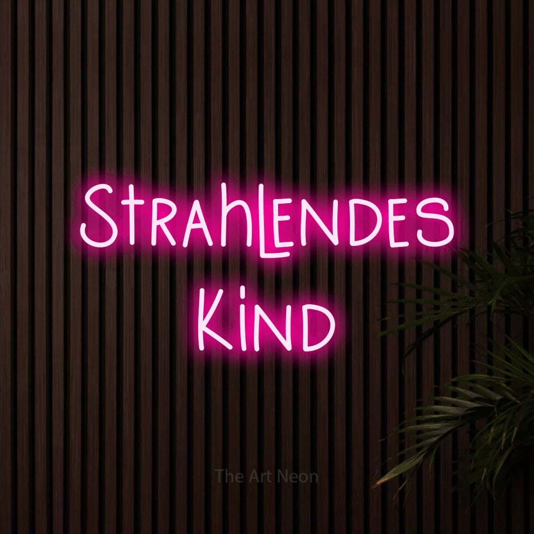 LED neon sign reading “Strahlendes Kind”, arranged in 2 lines.
