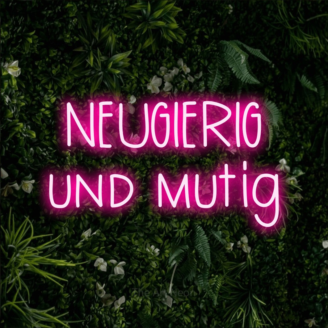 LED neon sign reading “NEUGIERIG und mutig”, arranged in 2 lines.