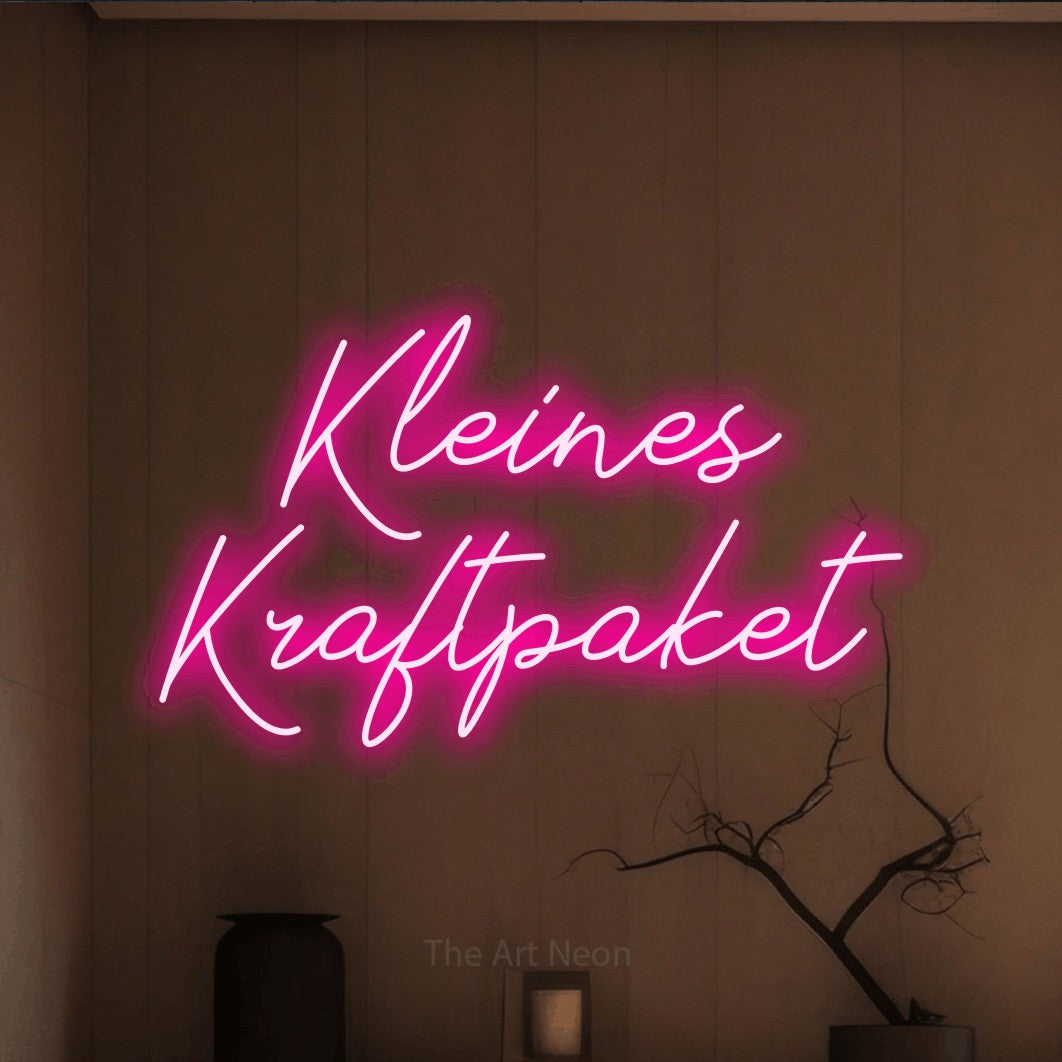 LED neon sign reading “Kleines Kraftpaket”, arranged in 2 lines.