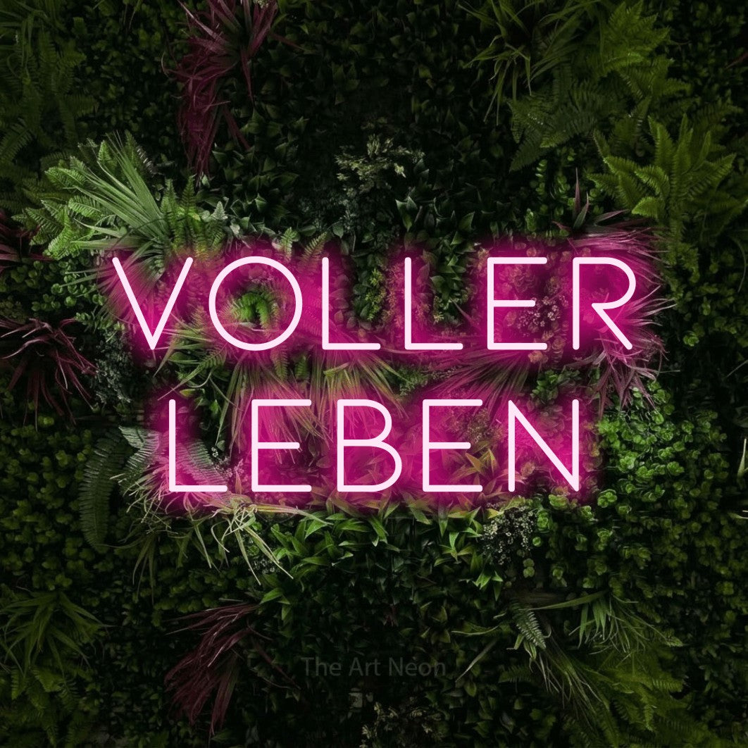LED neon sign reading “voller leben”, arranged in 2 lines.