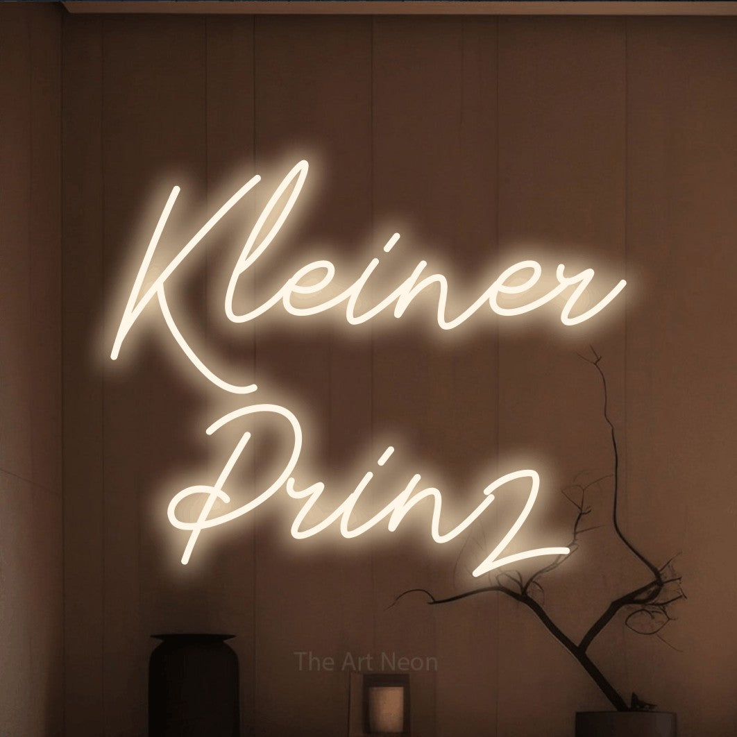 LED neon sign reading “Kleiner Prinz”, arranged in 2 lines.