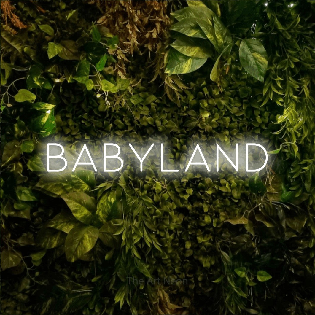 LED neon sign reading “Babyland”, arranged in a single line.