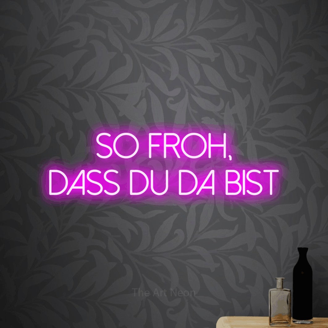 LED neon sign reading “So froh, dass du da bist”, arranged in 2 lines.