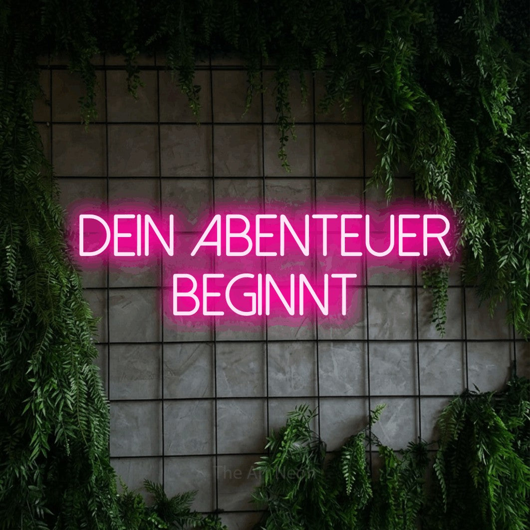 LED neon sign reading “Dein Abenteuer beginnt”, arranged in 2 lines.