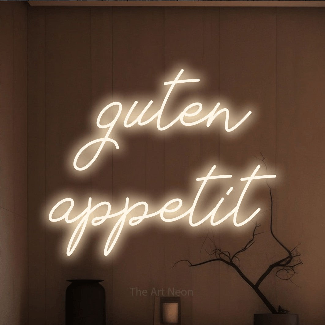 LED neon sign reading “guten appetit”, arranged in 2 lines.