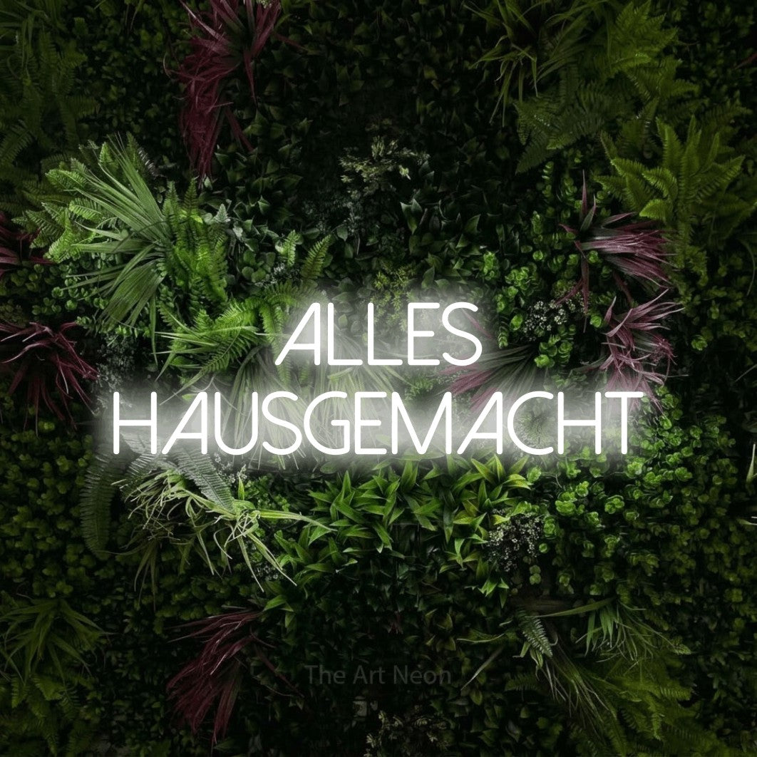 LED neon sign reading “alles HAUSGEMACHT”, arranged in 2 lines.