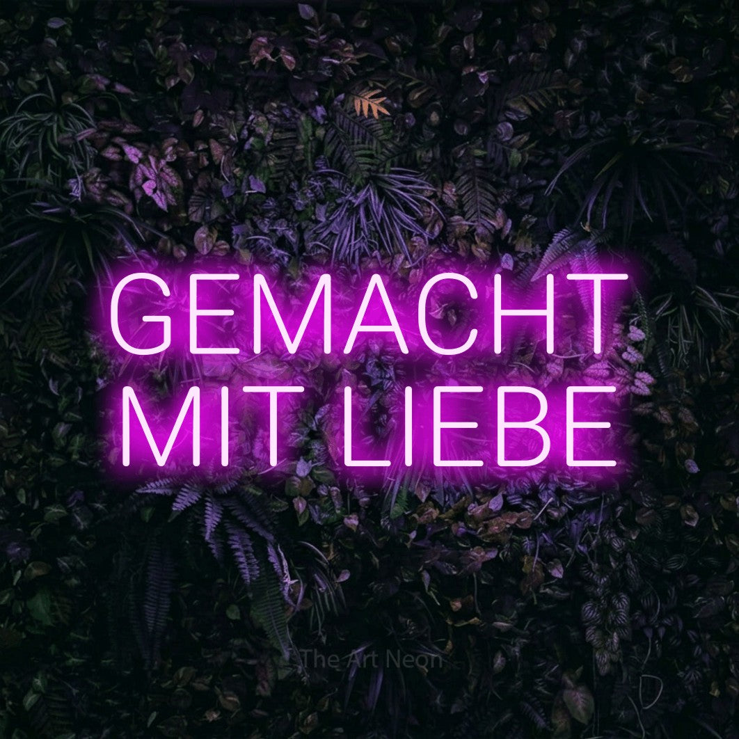 LED neon sign reading “GEMACHT MIT LIEBE”, arranged in 2 lines.