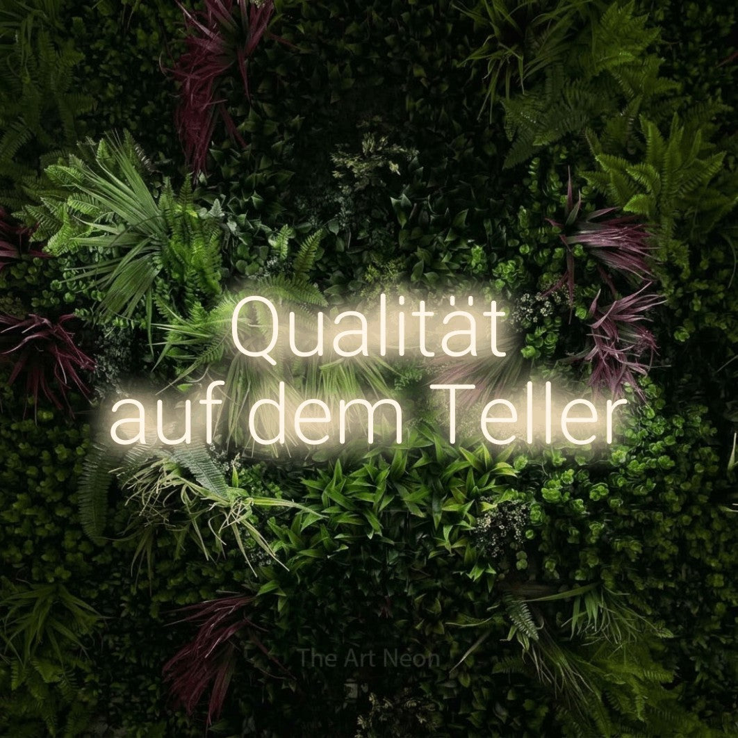 LED neon sign reading “Qualität auf dem Teller”, arranged in 2 lines.