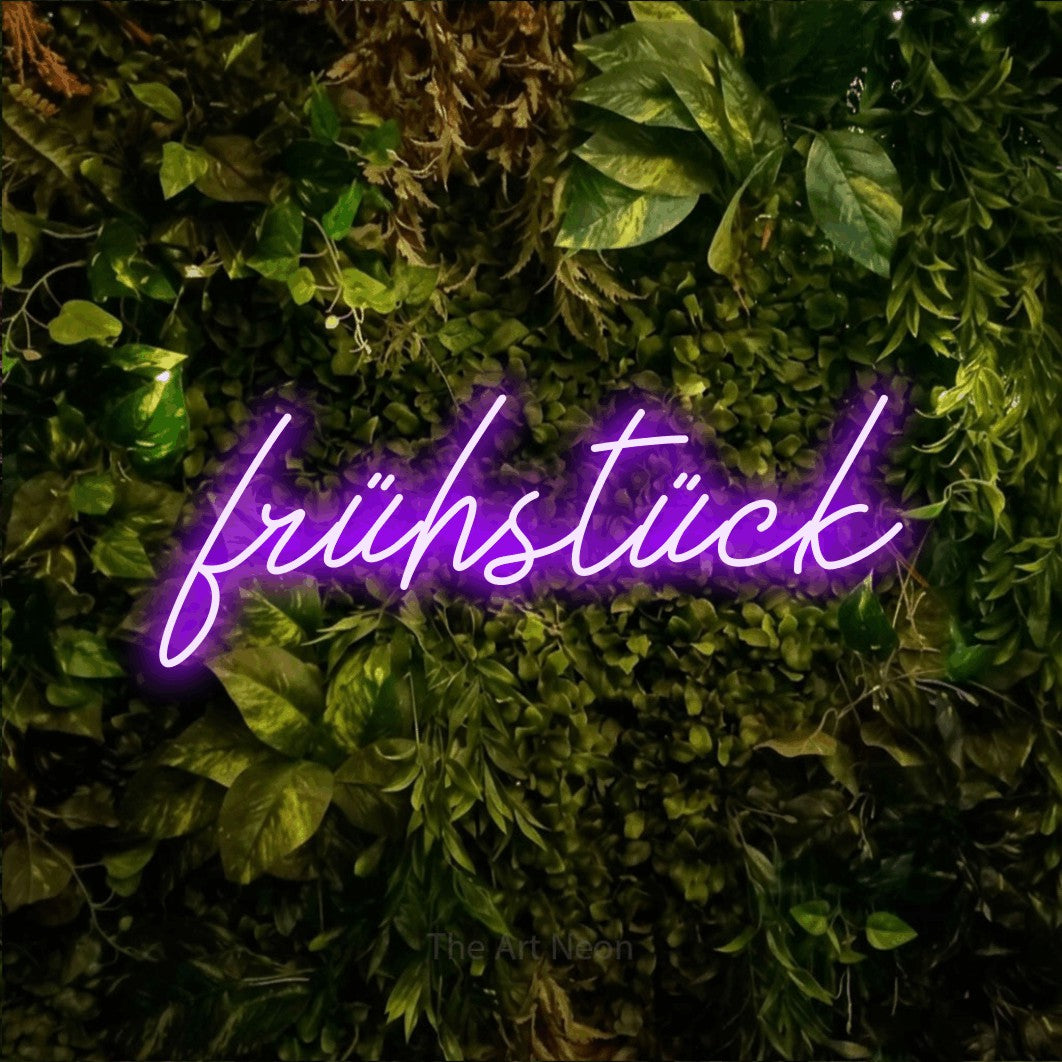 LED neon sign reading “frühstück”, arranged in a single line.