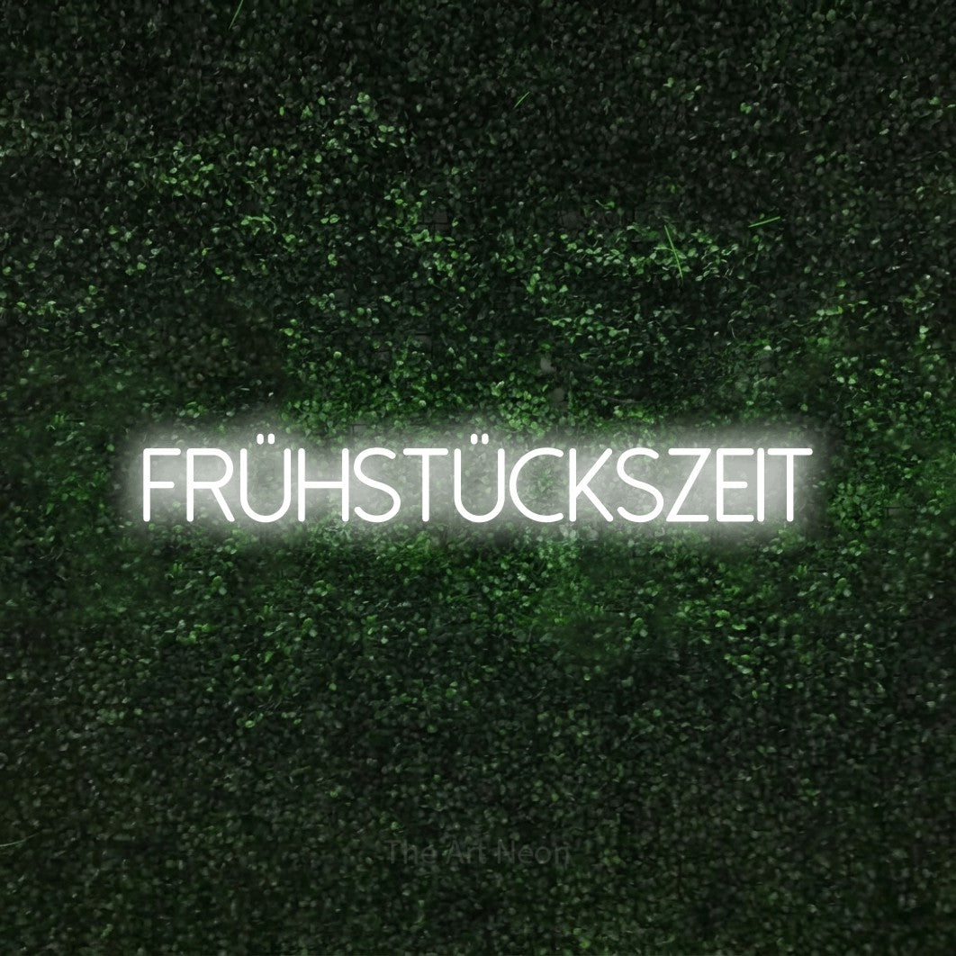 LED neon sign reading “frühstückszeit”, arranged in a single line.