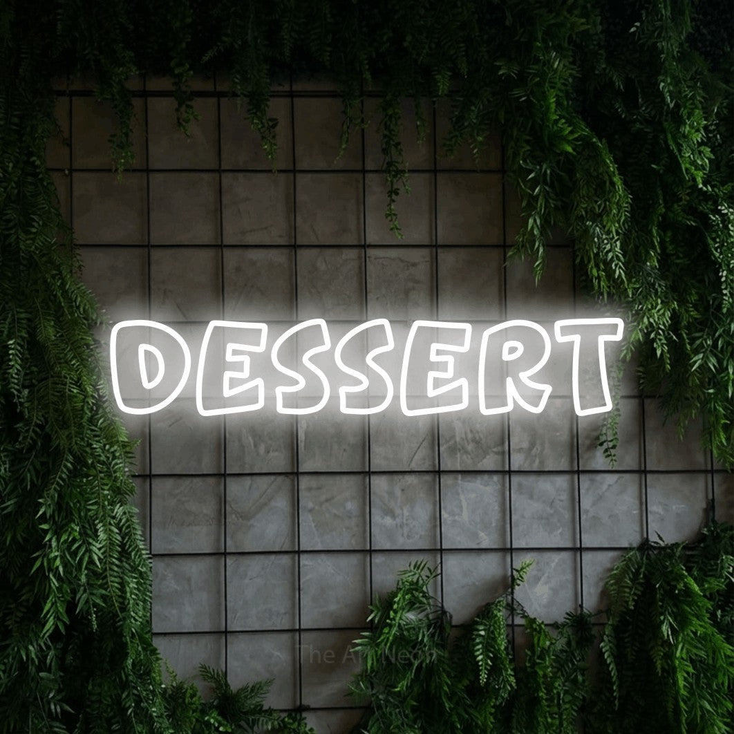 LED neon sign reading “dessert”, arranged in a single line.