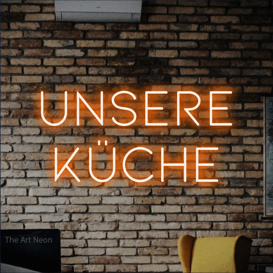 LED neon sign reading “unsere küche”, arranged in 2 lines.