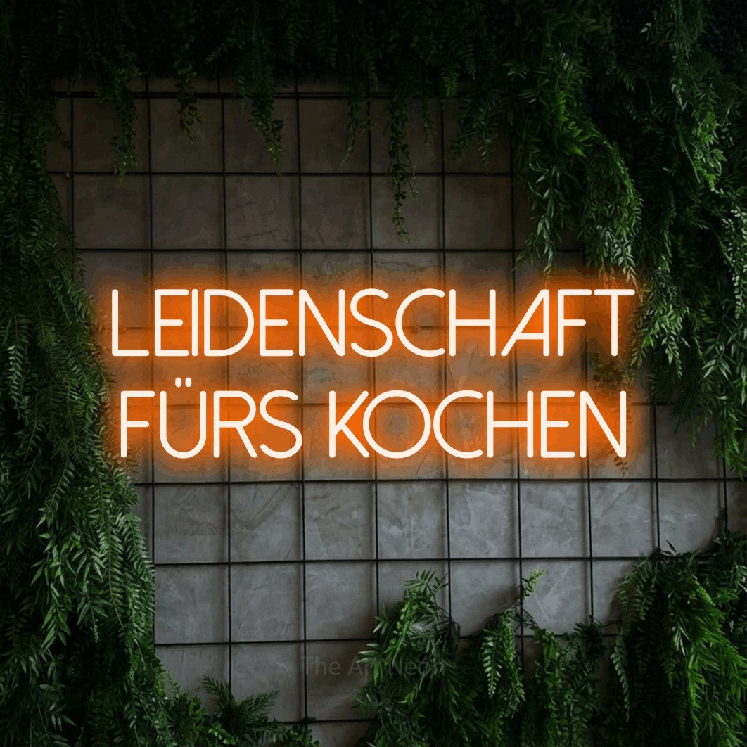 LED neon sign displaying “Leidenschaft fürs Kochen”.
