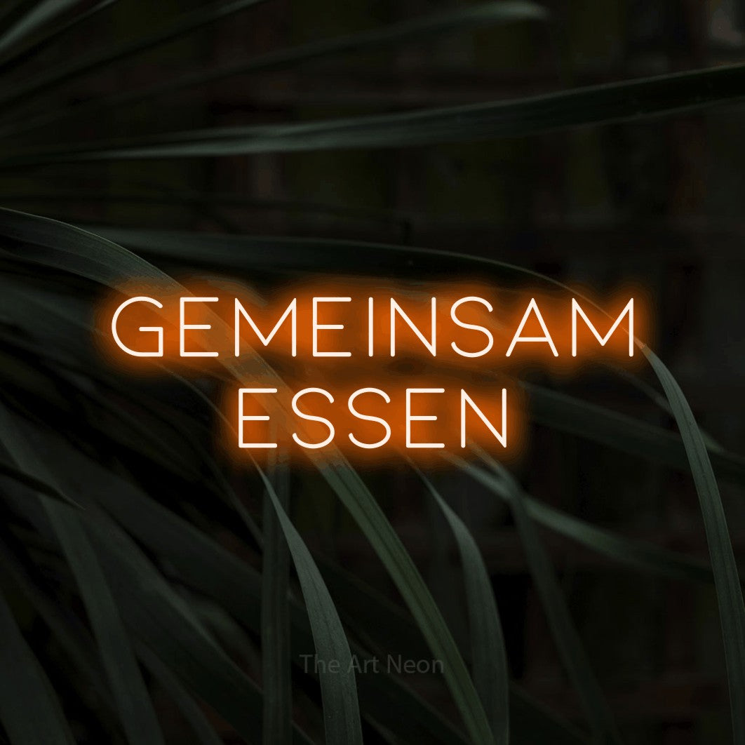 LED neon sign reading “GEMEINSAM ESSEN”, arranged in 2 lines.