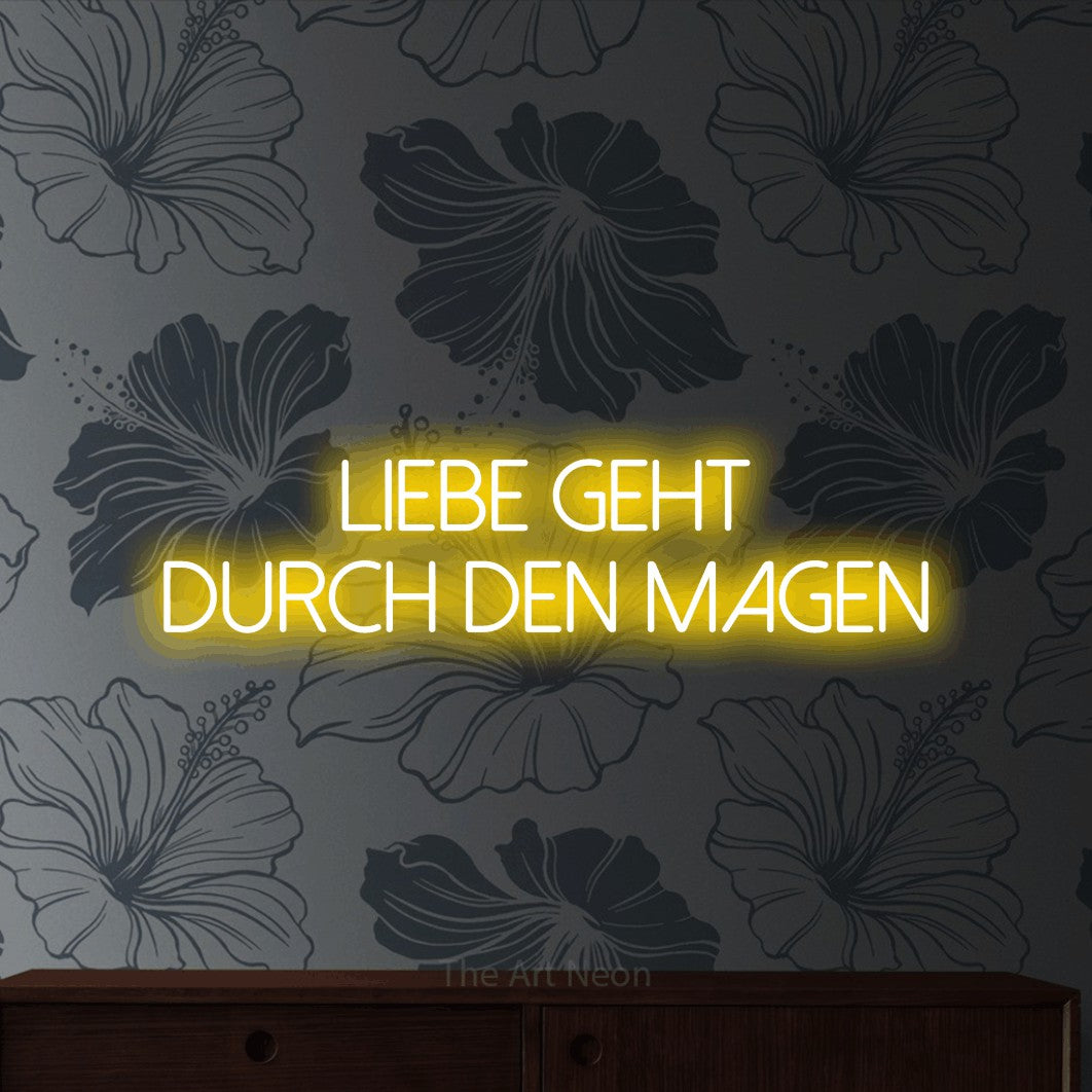 LED neon sign reading “Liebe geht durch den Magen”, arranged in 2 lines.