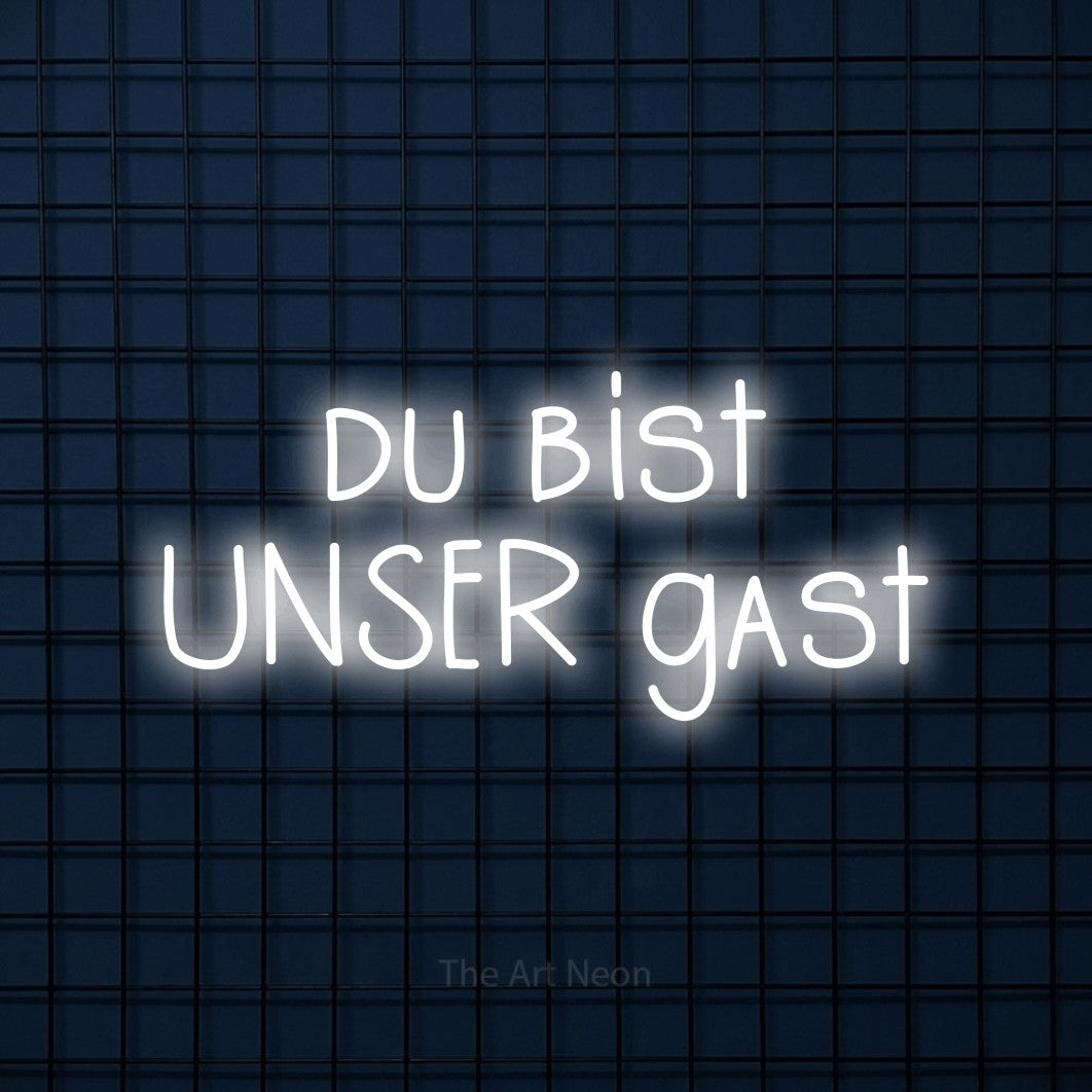 LED neon sign reading “du bist UNSER gast”, arranged in 2 lines.