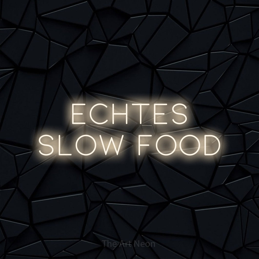 LED neon sign reading “ECHTES SLOW FOOD”, arranged in 2 lines.