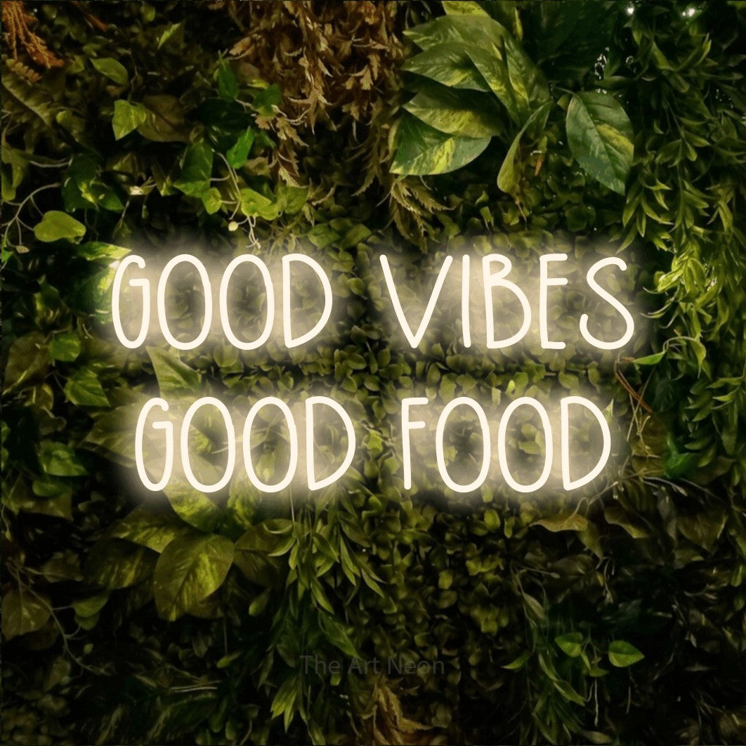LED neon sign reading “GOOD VIBES GOOD FOOD”, arranged in 2 lines.