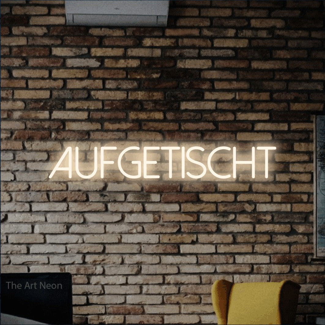 LED neon sign reading “AUFGETISCHT”, arranged in a single line.