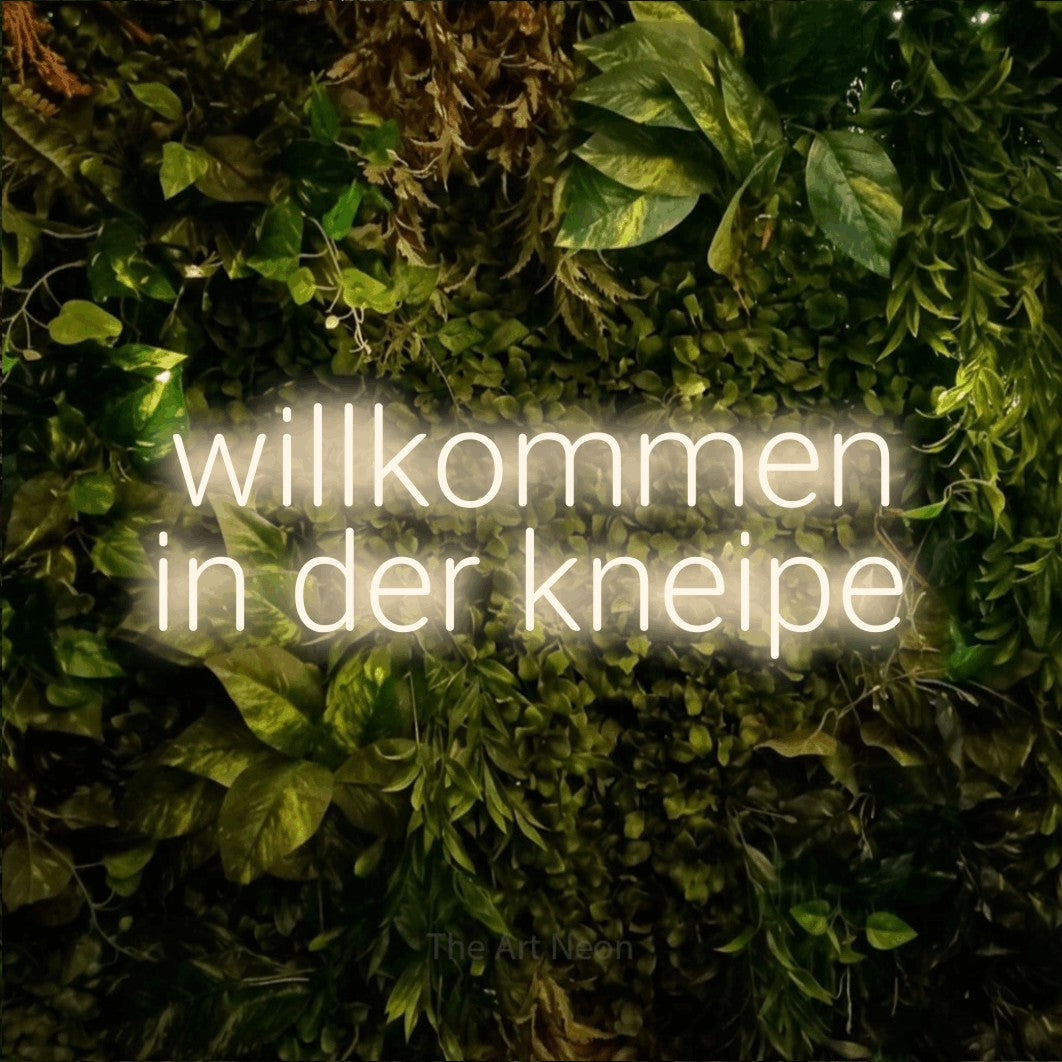 LED neon sign reading “willkommen in der kneipe”, arranged in 2 lines.