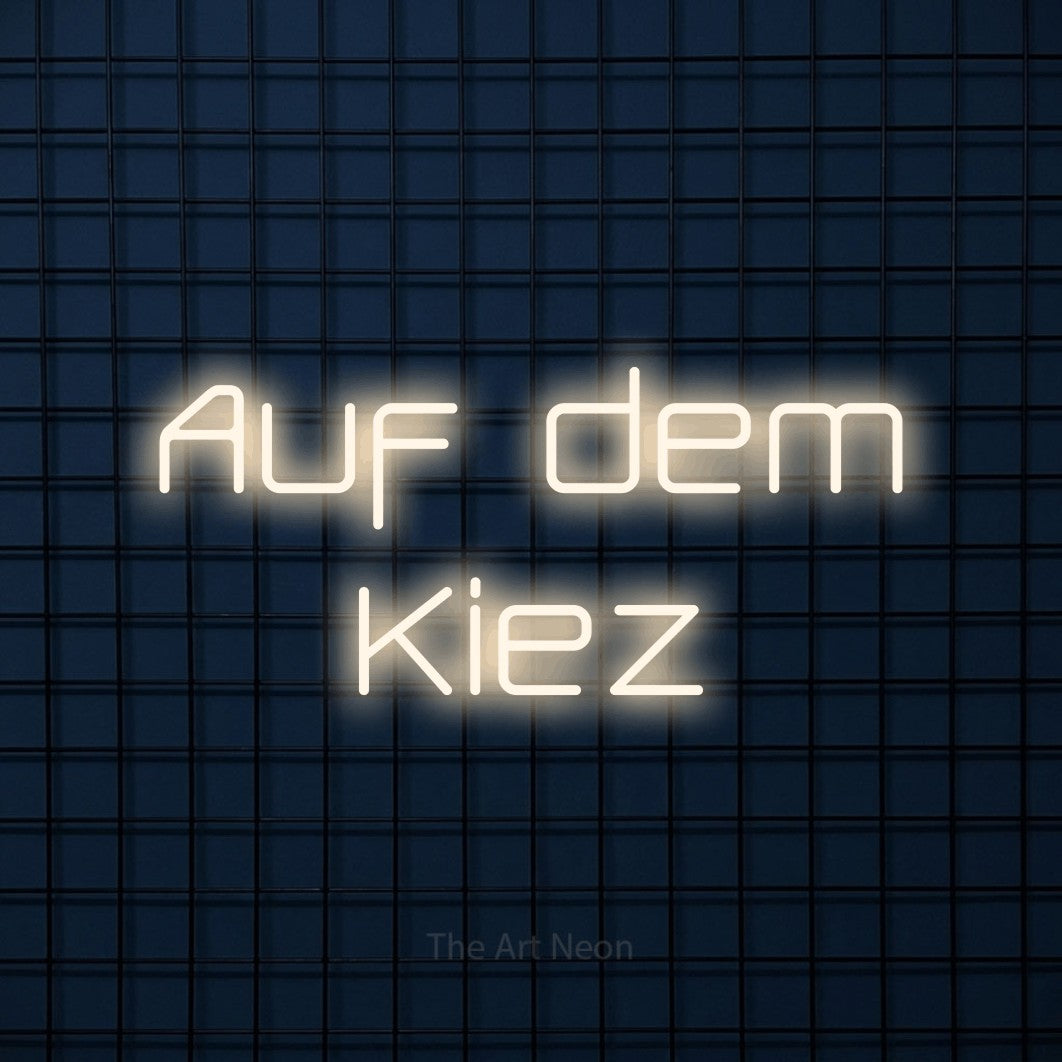 LED neon sign reading “Auf dem Kiez”, arranged in 2 lines.
