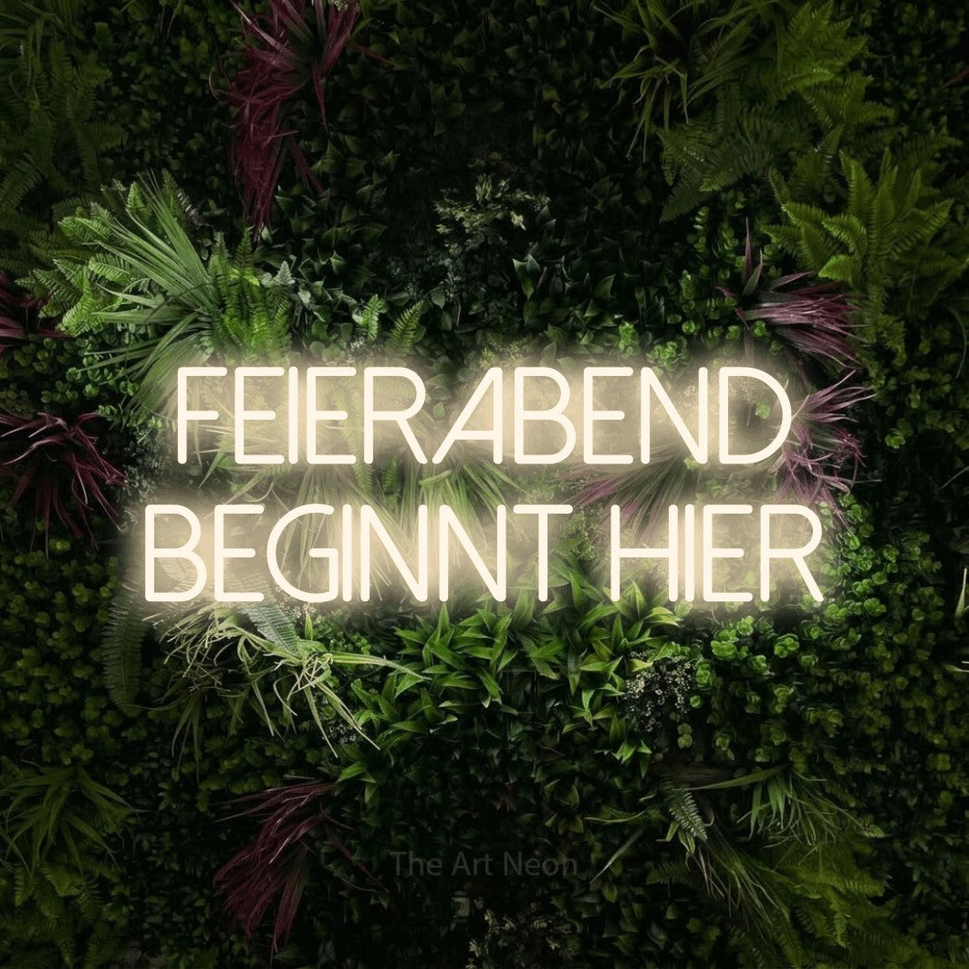 LED neon sign reading “Feierabend beginnt hier”, arranged in 2 lines.