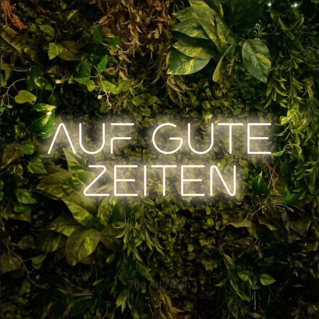 LED neon sign reading “AUF GUTE ZEITEN”, arranged in 2 lines.