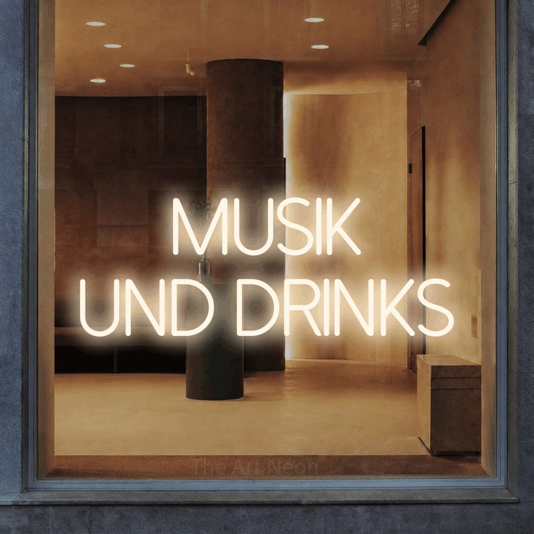 LED neon sign reading “musik und DRINKS”, arranged in 2 lines.